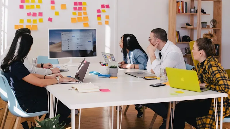 Small team reviewing customer experience trends during a working session