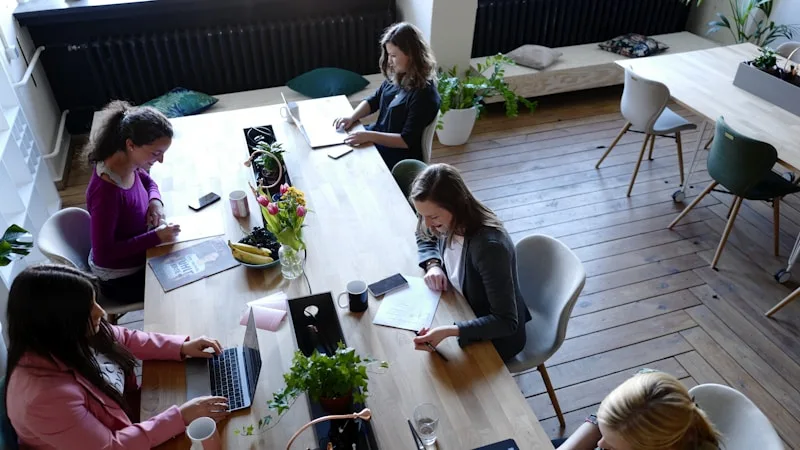 Professionals reviewing customer feedback results together at a table